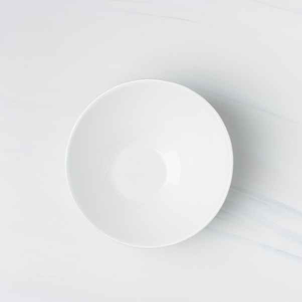 flatlay photography of white ceramic bowl