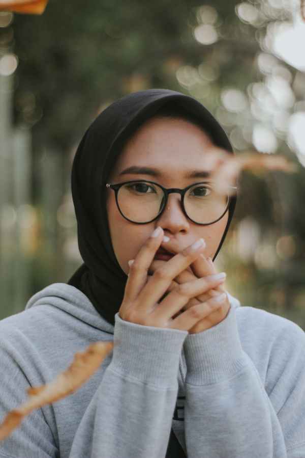 woman wearing eyeglasses and black hijab
